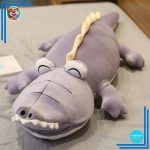 Peluche dinosaure violet magique