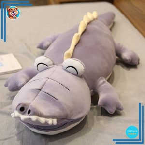 Peluche dinosaure violet magique