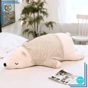 Peluche ours blanc habillé qui dort