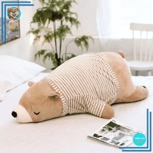 Peluche ours marron habillé qui dort